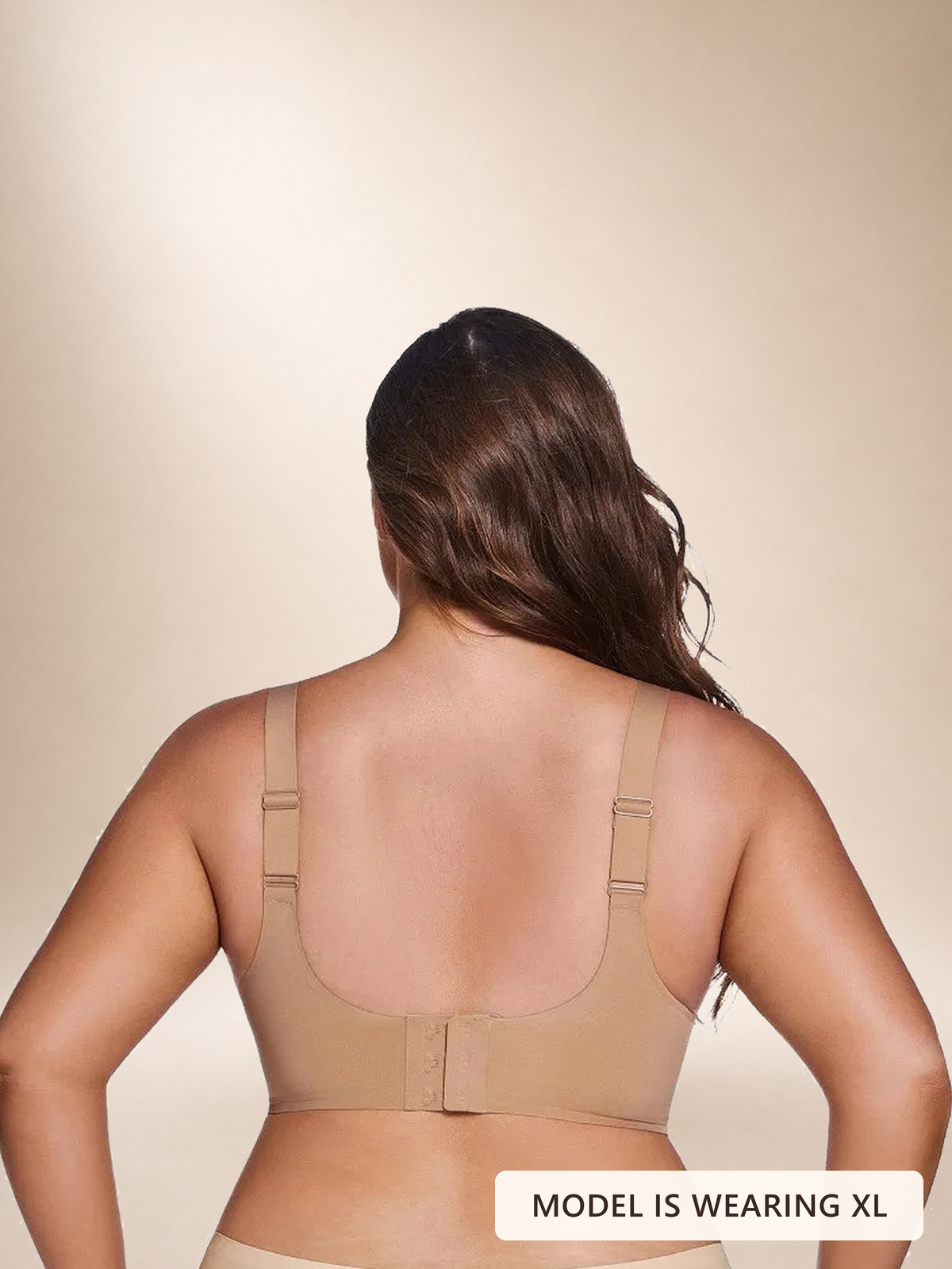 Back view of a model wearing the Faveno Jelly Bra in Medium Nude, size XL. Image label: Model is wearing XL.